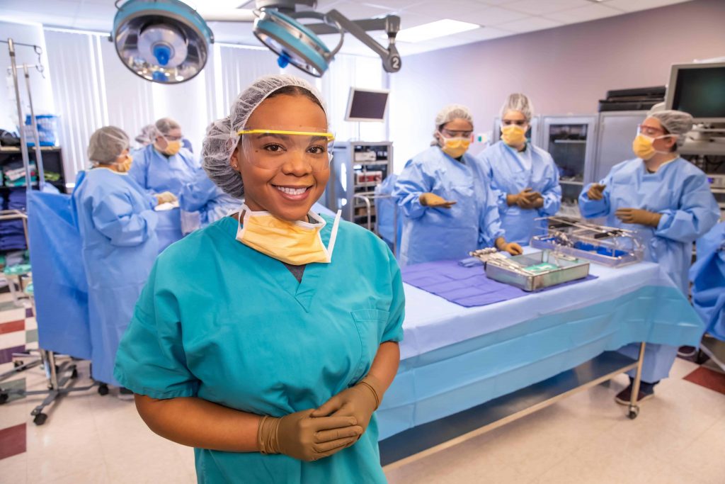 A surgical technology student working in an operating room