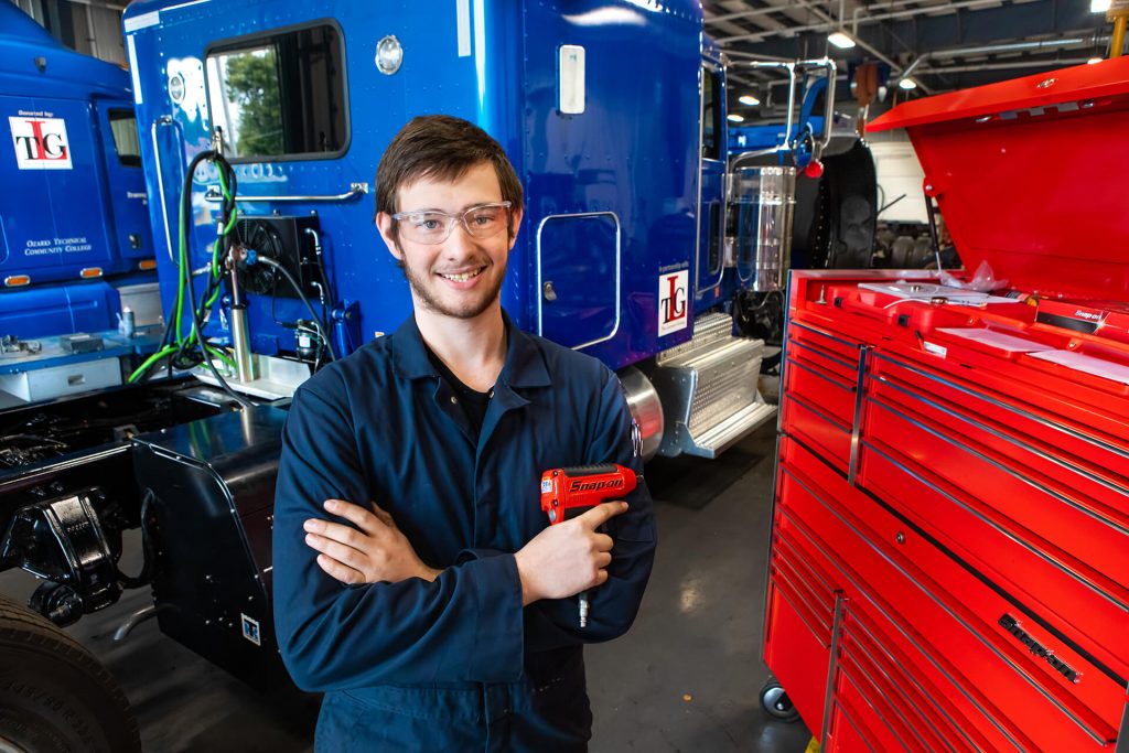 A diesel technology student finding tools in a toolbox